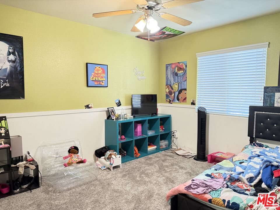18238 Kalin Ranch Drive Victorville, CA 92395 - Photo 22 of 33 a bedroom with furniture and a bed