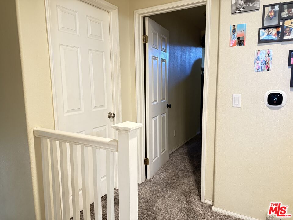 18238 Kalin Ranch Drive Victorville, CA 92395 - Photo 24 of 33 a view of a hallway