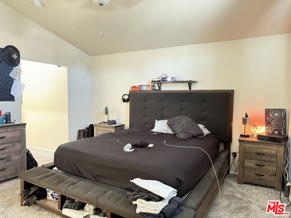 18238 Kalin Ranch Drive Victorville, CA 92395 - Photo 26 of 33 a bedroom with a bed and a dresser