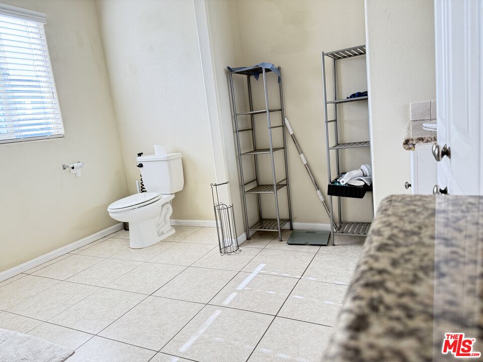18238 Kalin Ranch Drive Victorville, CA 92395 - Photo 28 of 33 a bathroom with a sink and a toilet