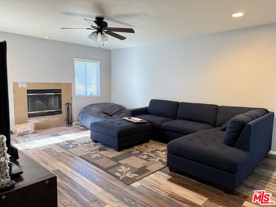 18238 Kalin Ranch Drive Victorville, CA 92395 - Photo 9 of 33 a living room with furniture and a fireplace