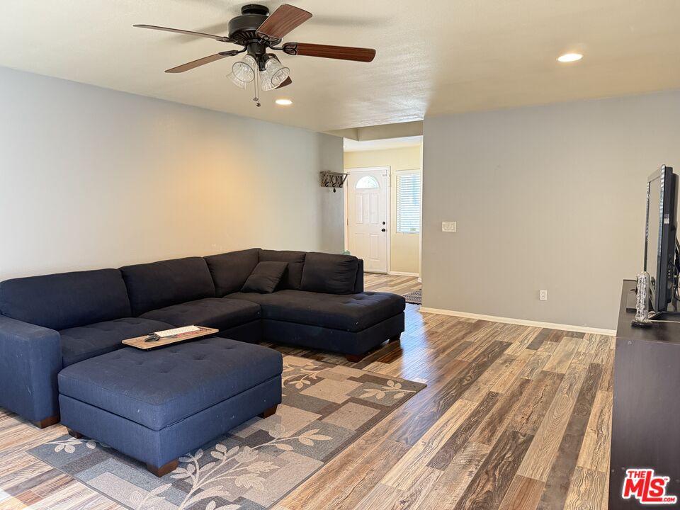 18238 Kalin Ranch Drive Victorville, CA 92395 - Photo 10 of 33 a living room with furniture and a flat screen tv
