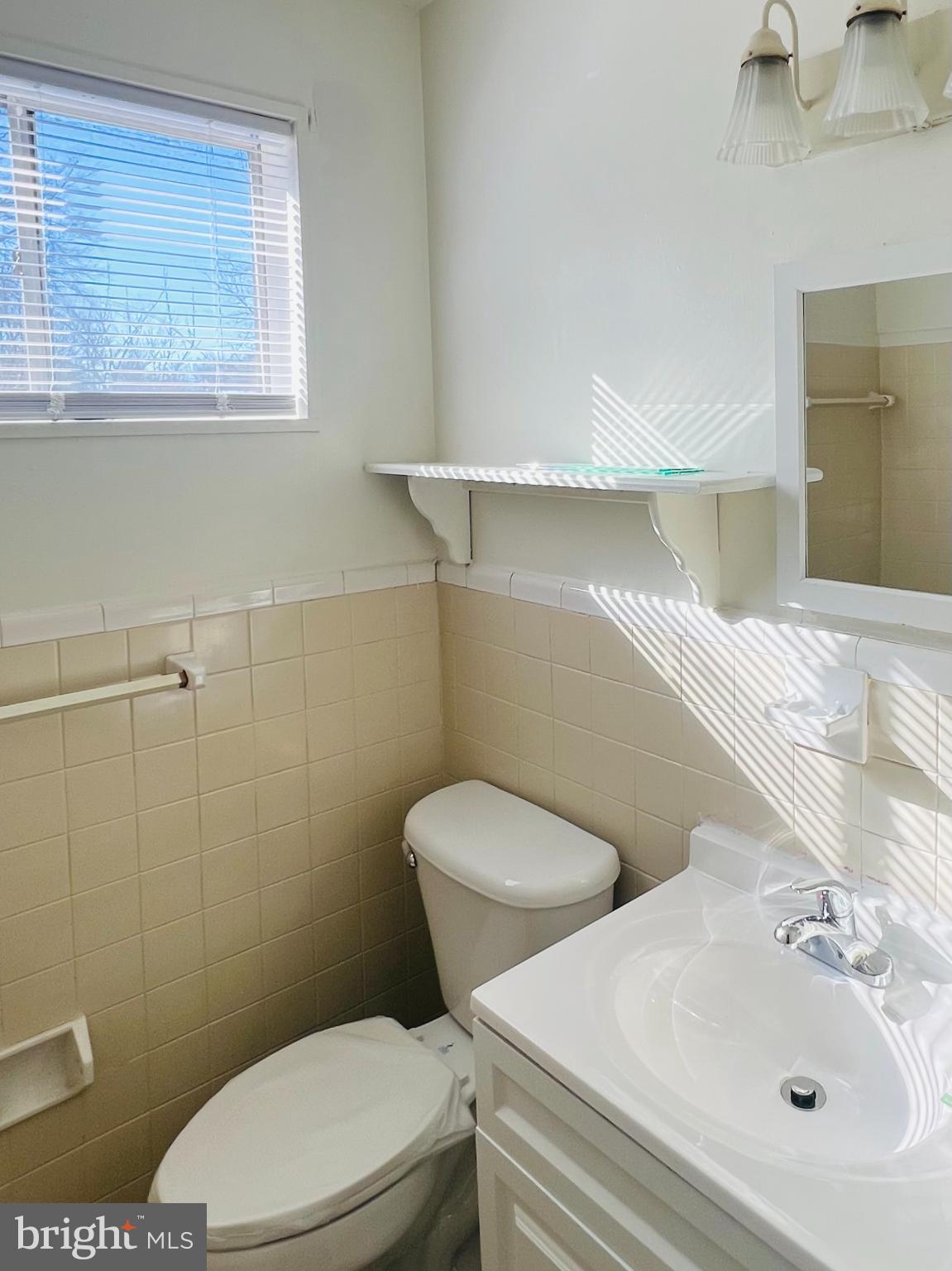4901 Fitch Place Northeast Washington, DC 20019 - Photo 21 of 47 a white toilet sitting next to a bathroom sink