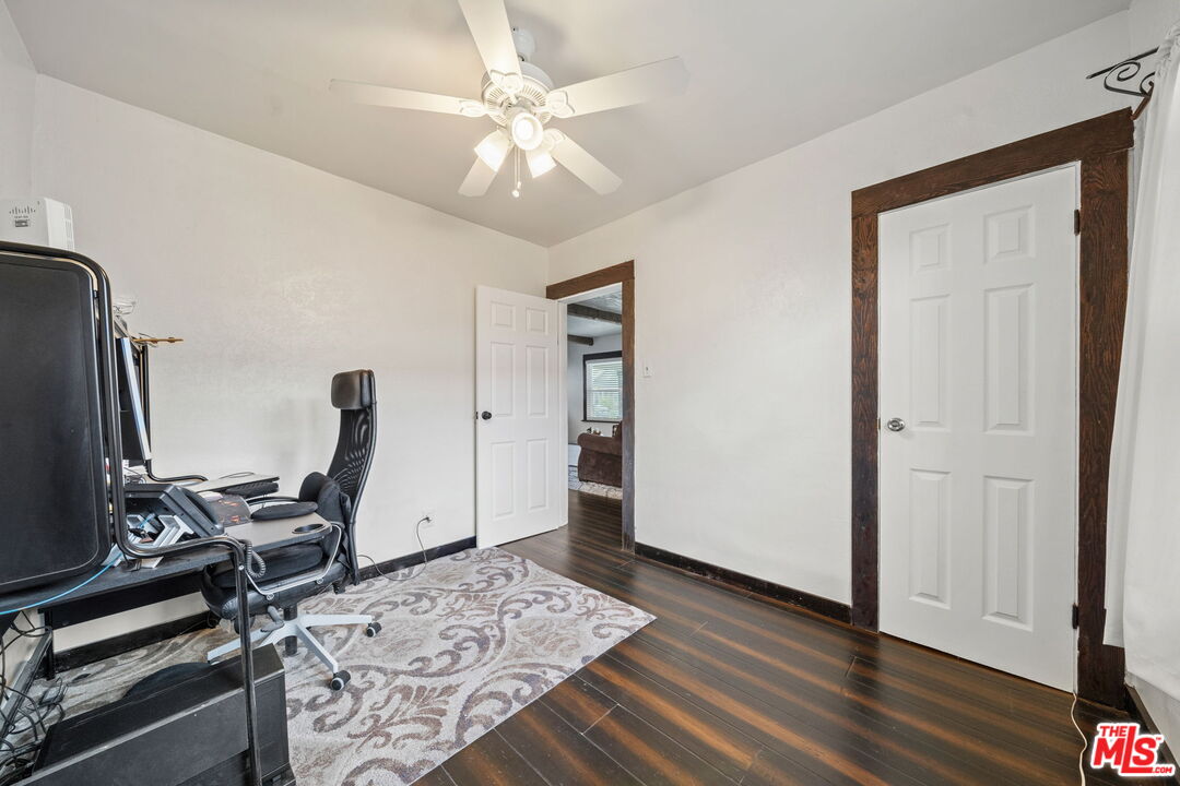 5732 6th Avenue Los Angeles, CA 90043 - Photo 16 of 22 a view of a workspace with furniture and wooden floor