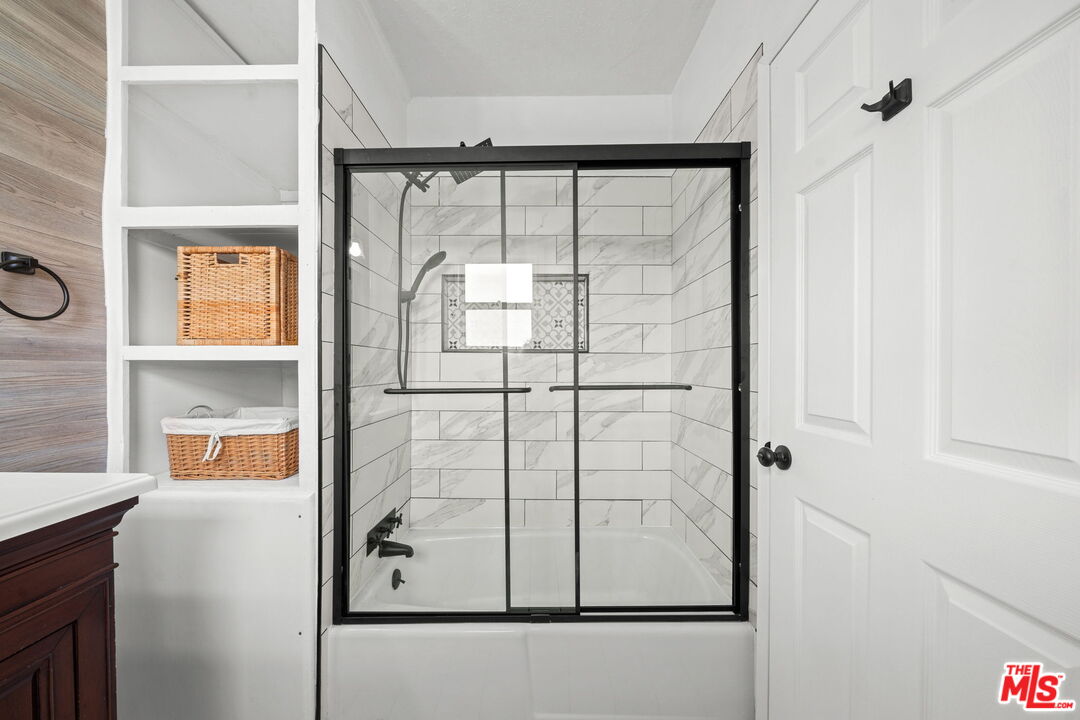5732 6th Avenue Los Angeles, CA 90043 - Photo 18 of 22 a bathroom with a glass shower door