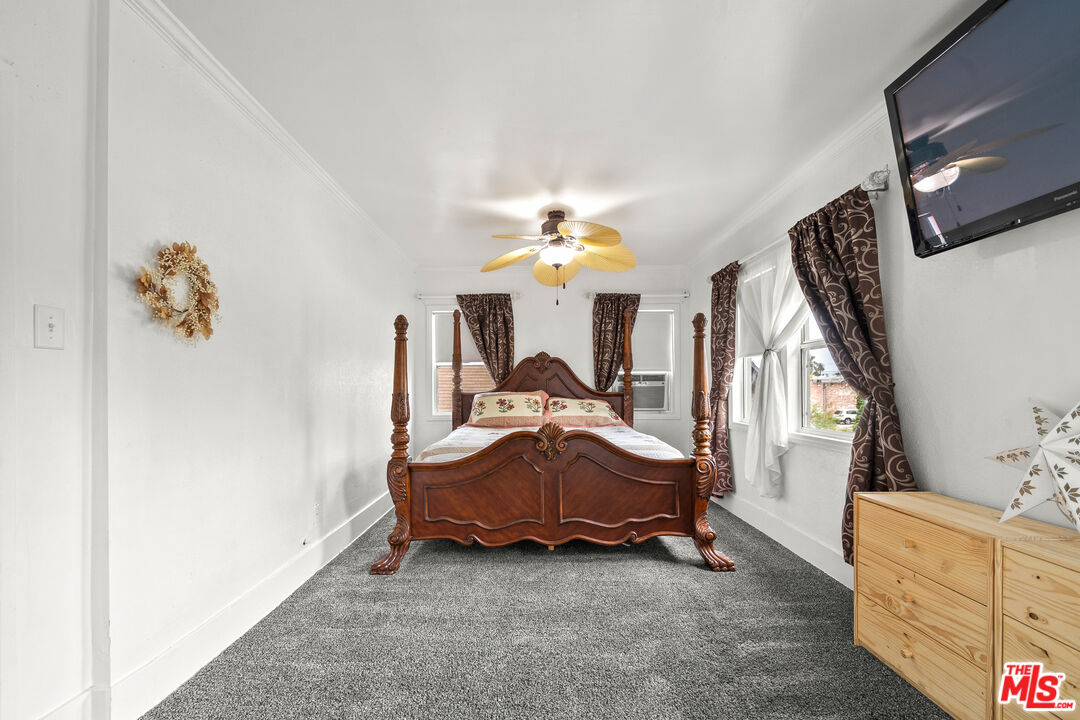 5732 6th Avenue Los Angeles, CA 90043 - Photo 19 of 22 a living room with furniture and a chandelier