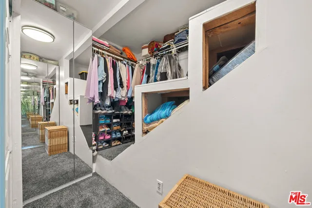 a view of an entryway with wooden floor and windows