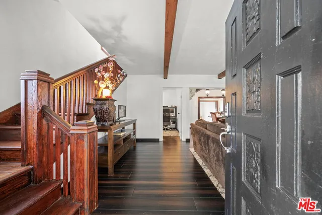 a kitchen with a refrigerator and a stove