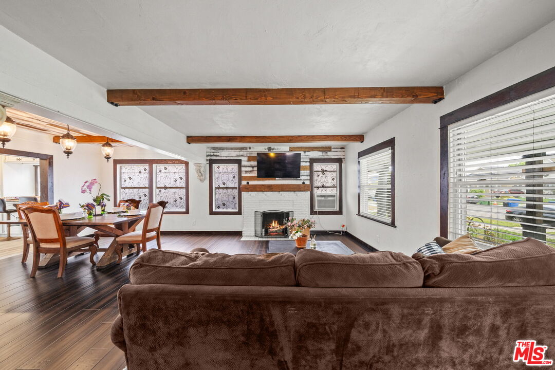 5732 6th Avenue Los Angeles, CA 90043 - Photo 4 of 22 a living room filled with furniture window and flat screen tv