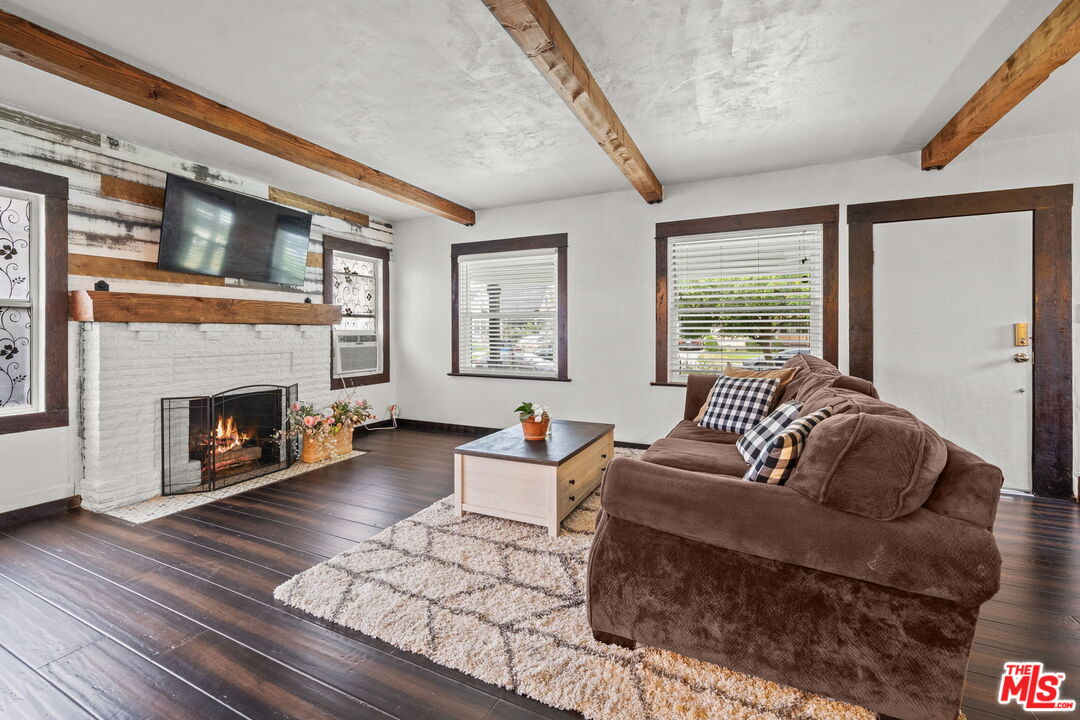 5732 6th Avenue Los Angeles, CA 90043 - Photo 6 of 22 a living room with furniture and a fireplace