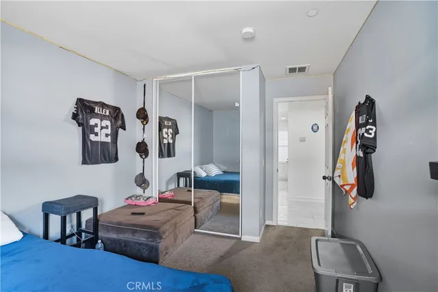 a room with a bed and furniture