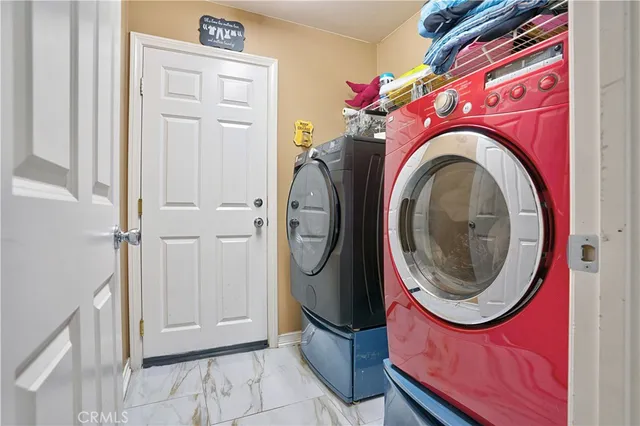 a kitchen with a refrigerator a sink and cabinets