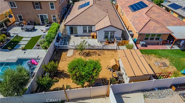 a view of a patio with table and chairs and wooden floor