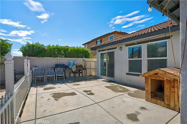 a view of a backyard with sitting area