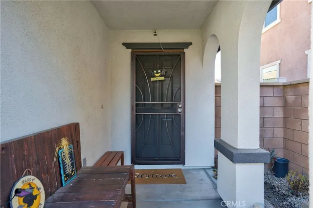 a view of hallway with stairs and wooden floor