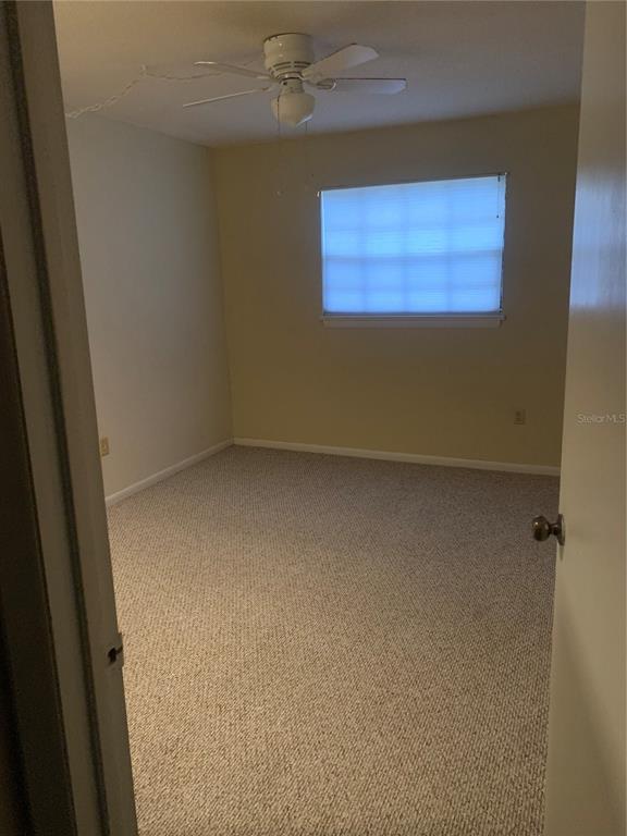 500 Newell Hill Road, Unit 104C Leesburg, FL 34748 - Photo 5 of 15 an empty room with a window