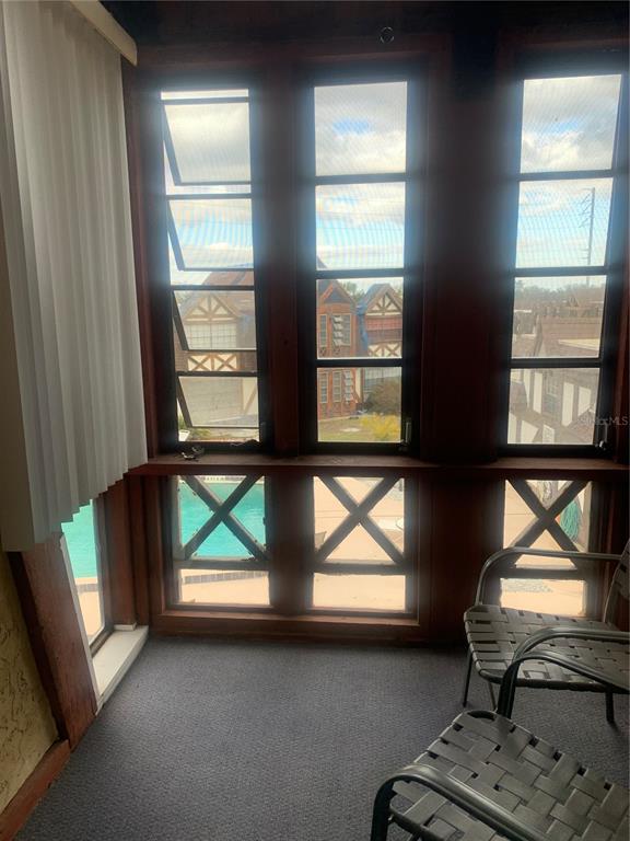 500 Newell Hill Road, Unit 104C Leesburg, FL 34748 - Photo 10 of 15 a living room with furniture and a window