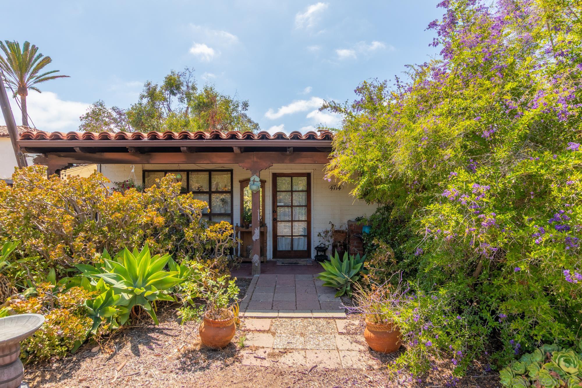 4714 Arizona Street San Diego, CA 92108 - Photo 4 of 10 a front view of a house with a yard