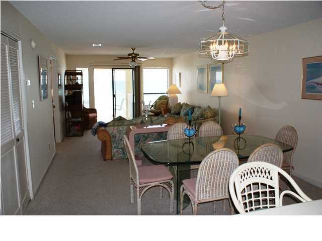 6015 Highway Santa Rosa Beach, Unit A201 30A Santa Rosa Beach, FL 32459 - Photo 2 of 24 a living room with furniture a chandelier and a chandelier