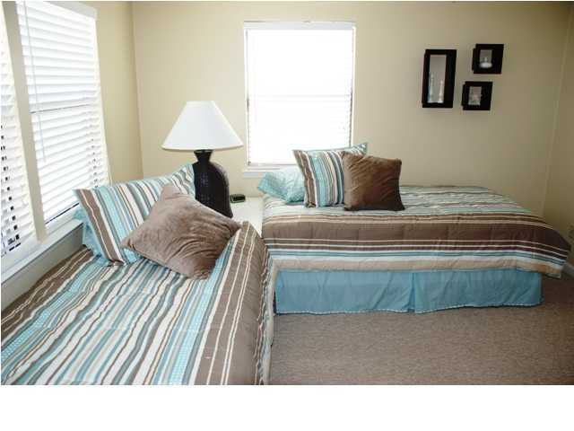 6015 Highway Santa Rosa Beach, Unit A201 30A Santa Rosa Beach, FL 32459 - Photo 11 of 24 a living room with a couch and a table