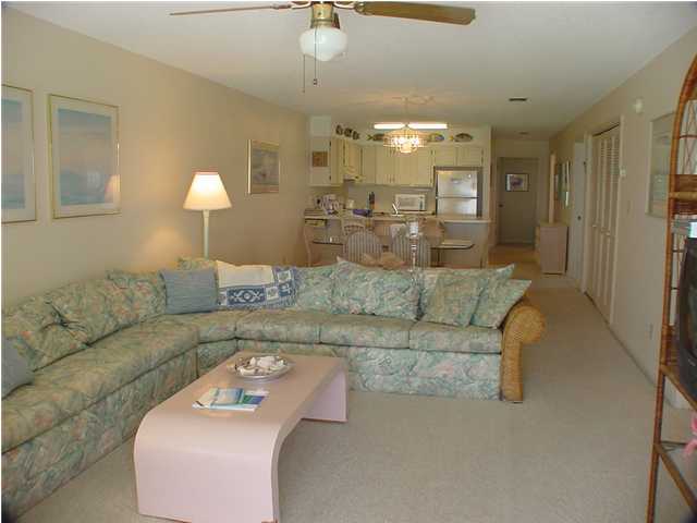 6015 Highway Santa Rosa Beach, Unit A201 30A Santa Rosa Beach, FL 32459 - Photo 3 of 24 a living room with furniture and a chandelier