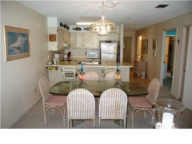 6015 Highway Santa Rosa Beach, Unit A201 30A Santa Rosa Beach, FL 32459 - Photo 4 of 24 a view of a dining room with furniture and chandelier