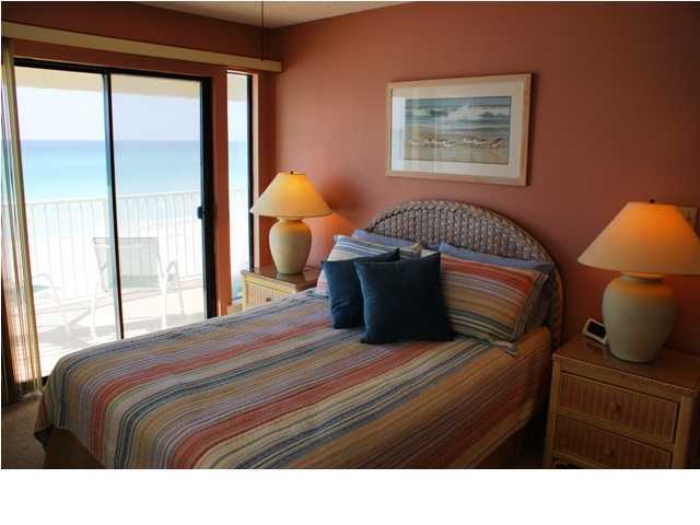 6015 Highway Santa Rosa Beach, Unit A201 30A Santa Rosa Beach, FL 32459 - Photo 8 of 24 a bedroom with a bed and lamp next to a window