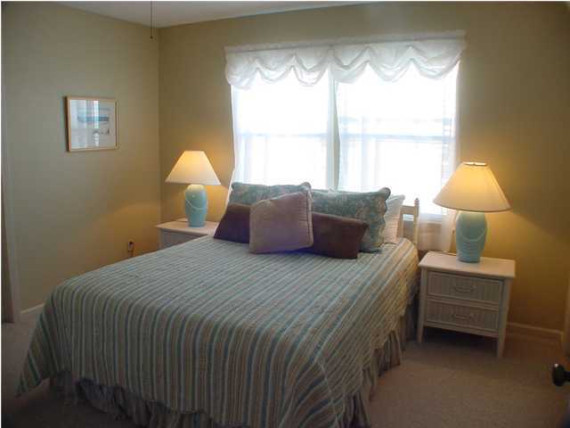 6015 Highway Santa Rosa Beach, Unit A201 30A Santa Rosa Beach, FL 32459 - Photo 10 of 24 a bedroom with a bed and a window