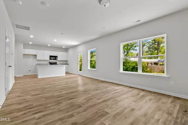 a view of a kitchen with a sink and a window