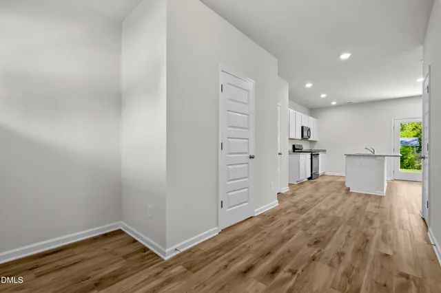 a view of kitchen and wooden floor