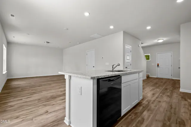 a view of a kitchen counter top space and wooden floor