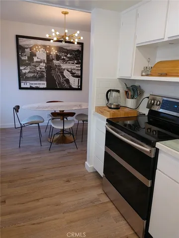 a view of room with window and hardwood floor