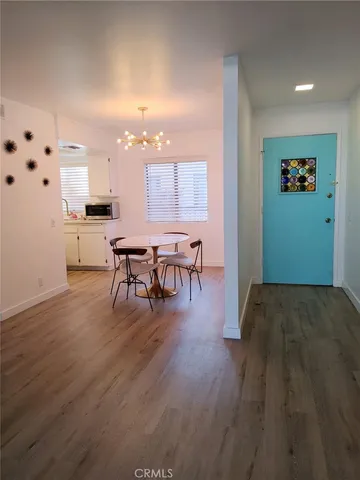 a living room with furniture rug and window
