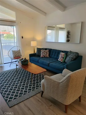 a view of a balcony with chair and table