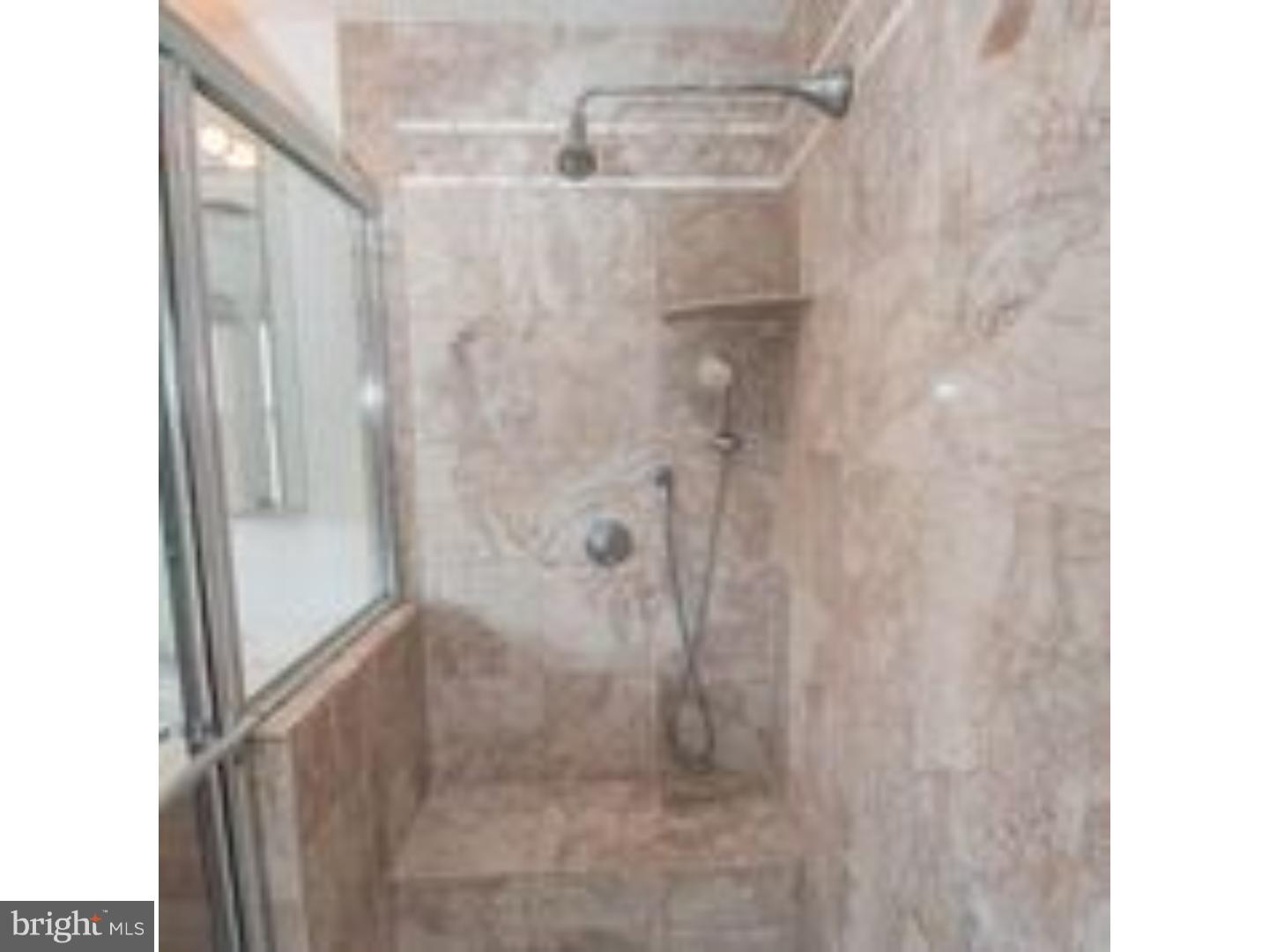 165 Ridgefield Road Newtown Square, PA 19073 - Photo 11 of 19 a bathroom with a glass shower door