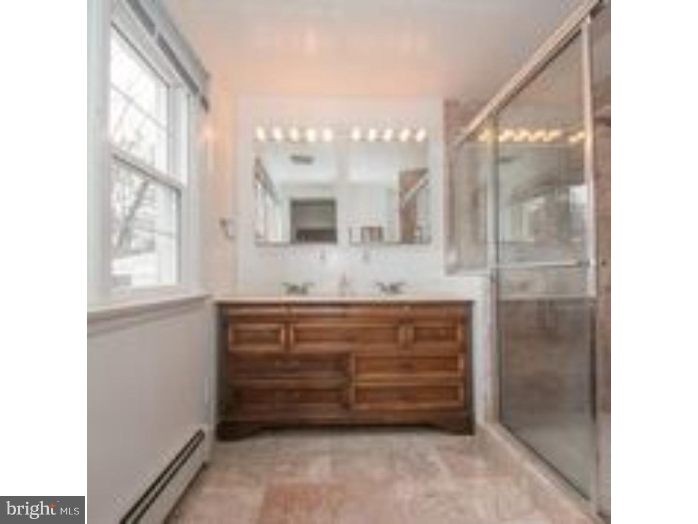 165 Ridgefield Road Newtown Square, PA 19073 - Photo 12 of 19 a bathroom with a granite countertop sink mirror and a