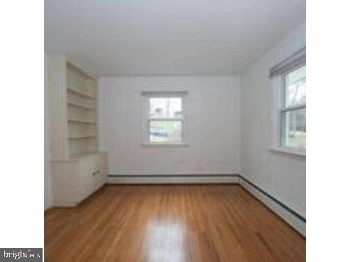 165 Ridgefield Road Newtown Square, PA 19073 - Photo 14 of 19 a view of empty room with wooden floor and fan