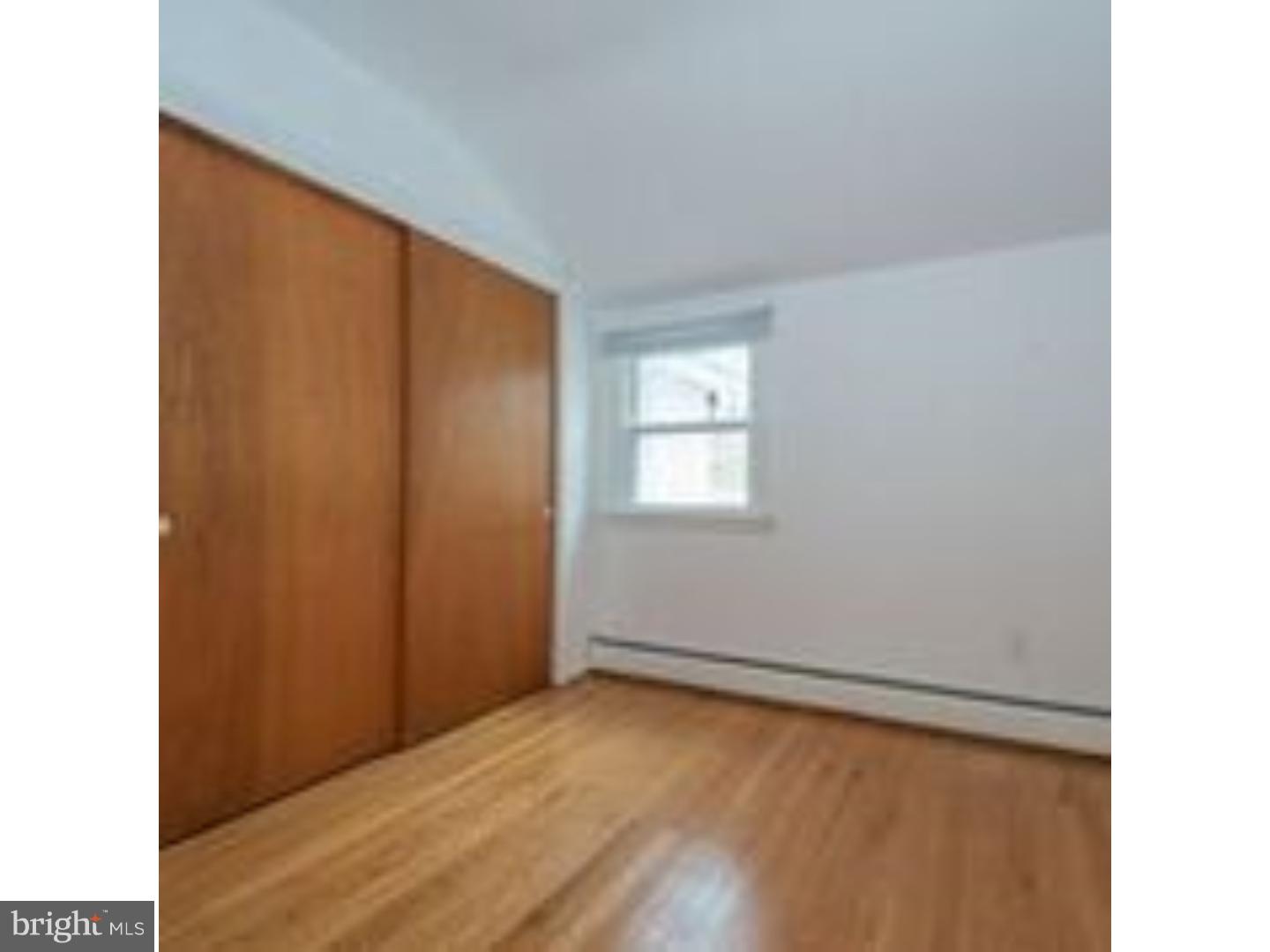 165 Ridgefield Road Newtown Square, PA 19073 - Photo 16 of 19 a view of an empty room with wooden floor