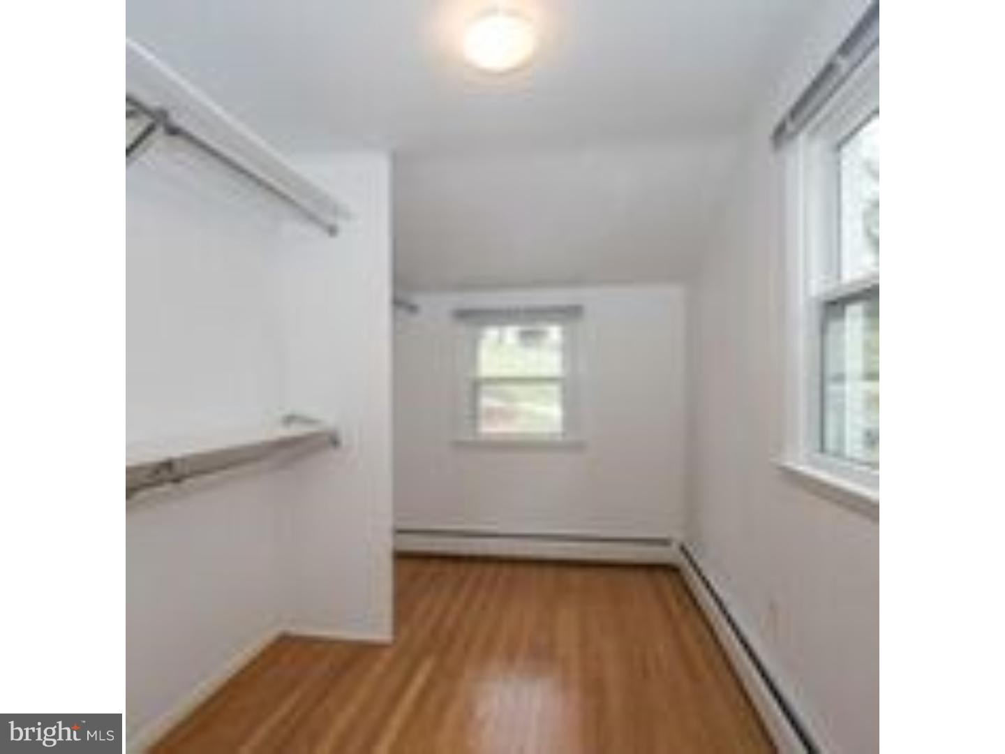 165 Ridgefield Road Newtown Square, PA 19073 - Photo 17 of 19 a view of a room with wooden floor and window