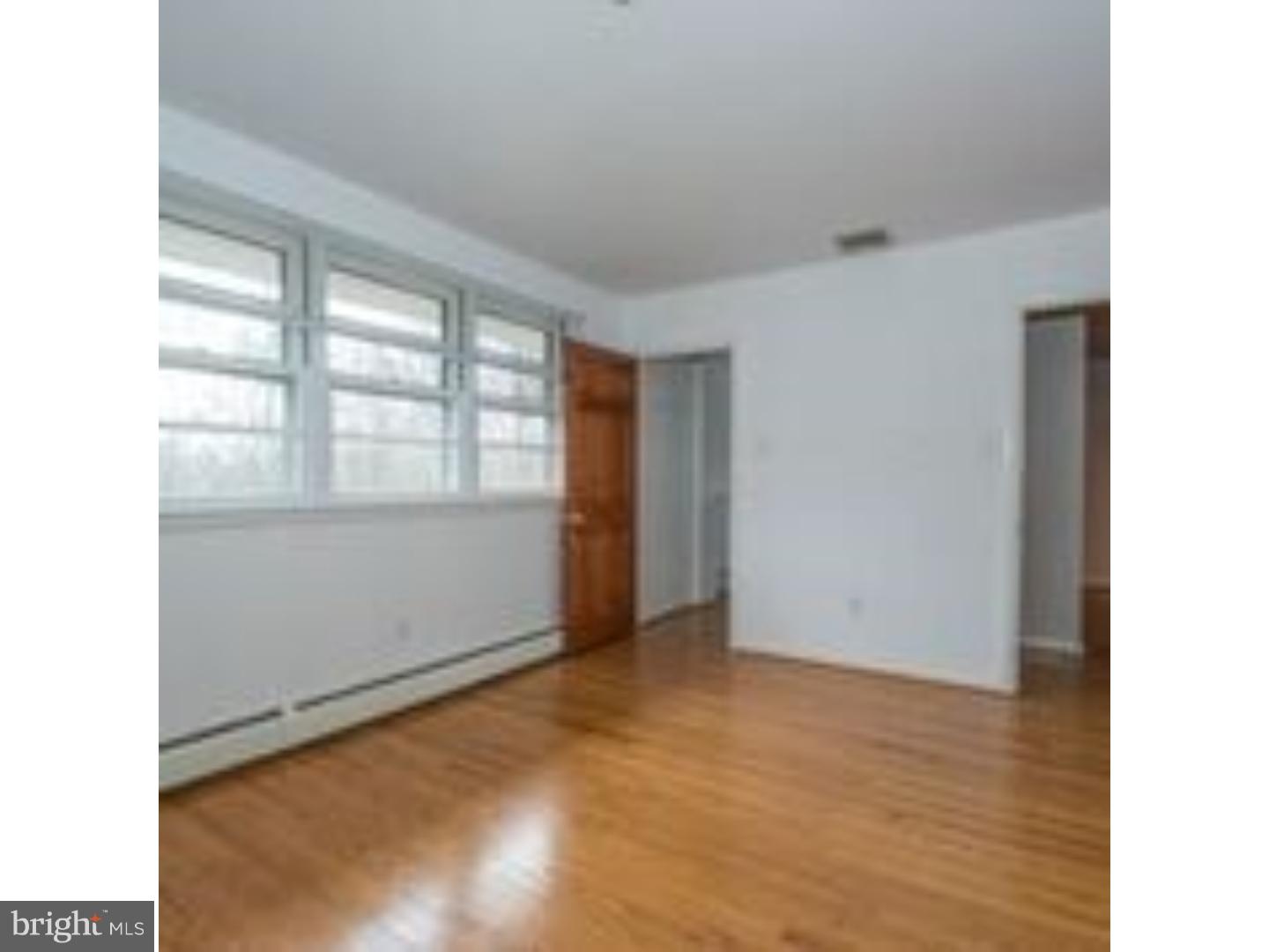 165 Ridgefield Road Newtown Square, PA 19073 - Photo 18 of 19 a view of an empty room with a window