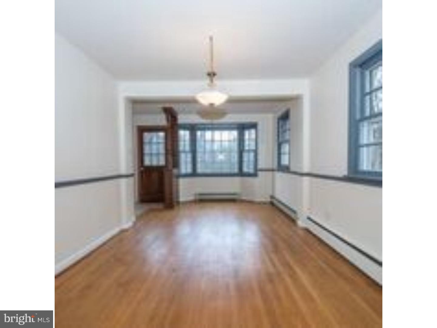 165 Ridgefield Road Newtown Square, PA 19073 - Photo 4 of 19 a view of wooden floor and a chandelier in a room