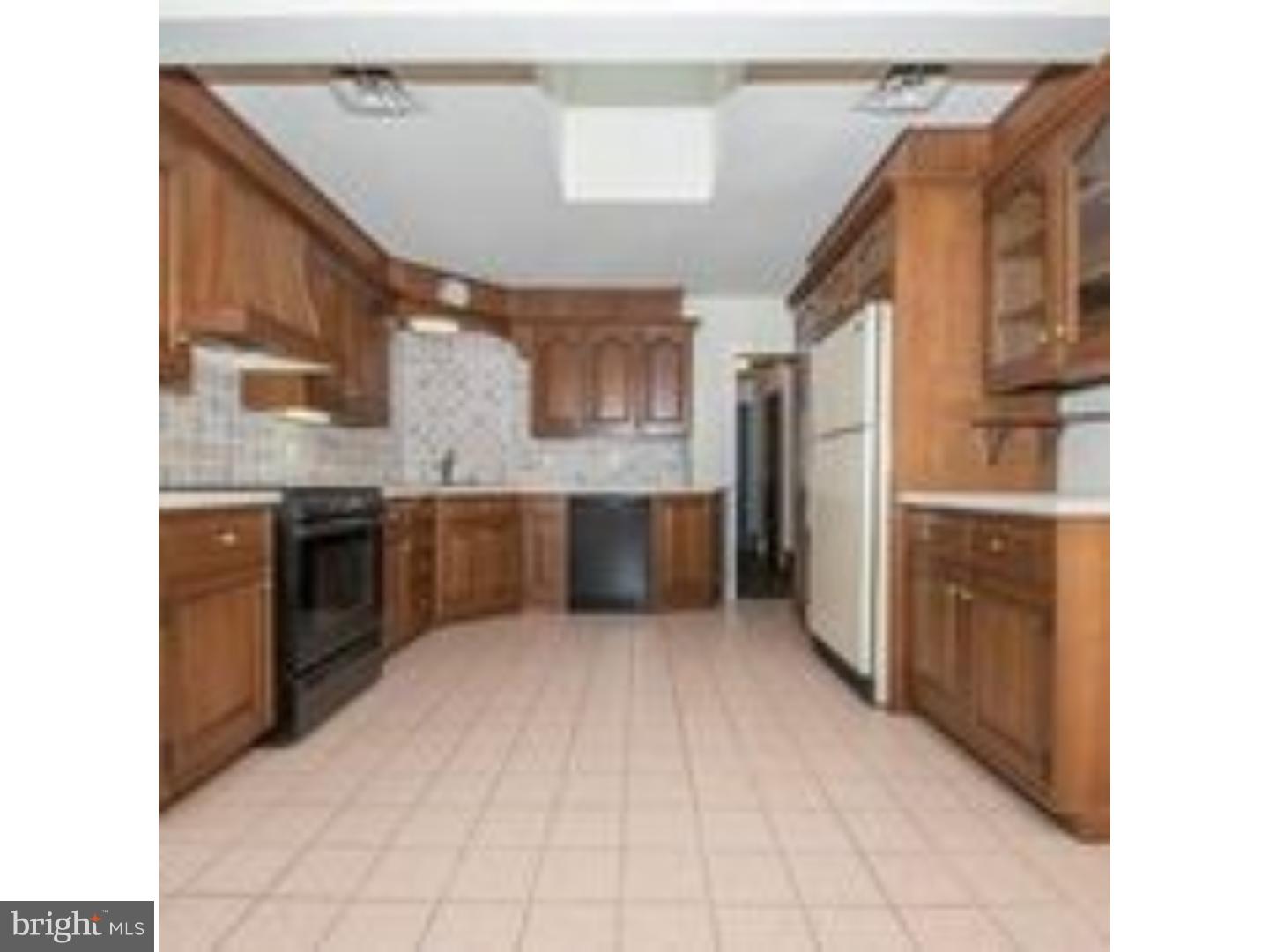 165 Ridgefield Road Newtown Square, PA 19073 - Photo 6 of 19 a large kitchen with stainless steel appliances granite countertop a refrigerator and a sink