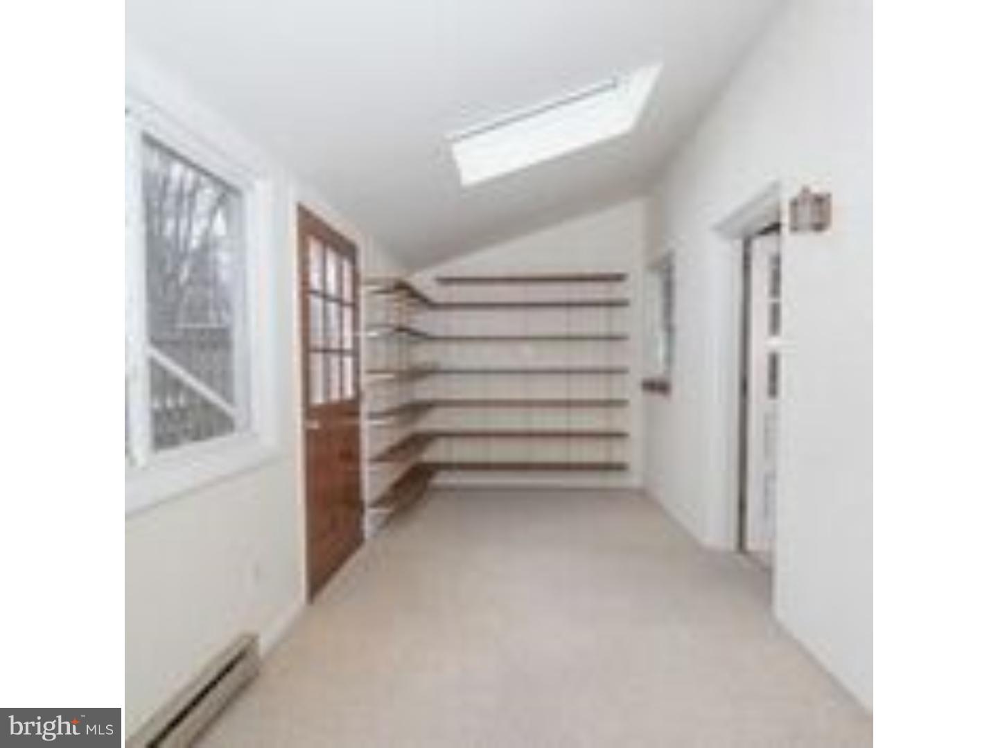 165 Ridgefield Road Newtown Square, PA 19073 - Photo 7 of 19 a view of closet area with racks