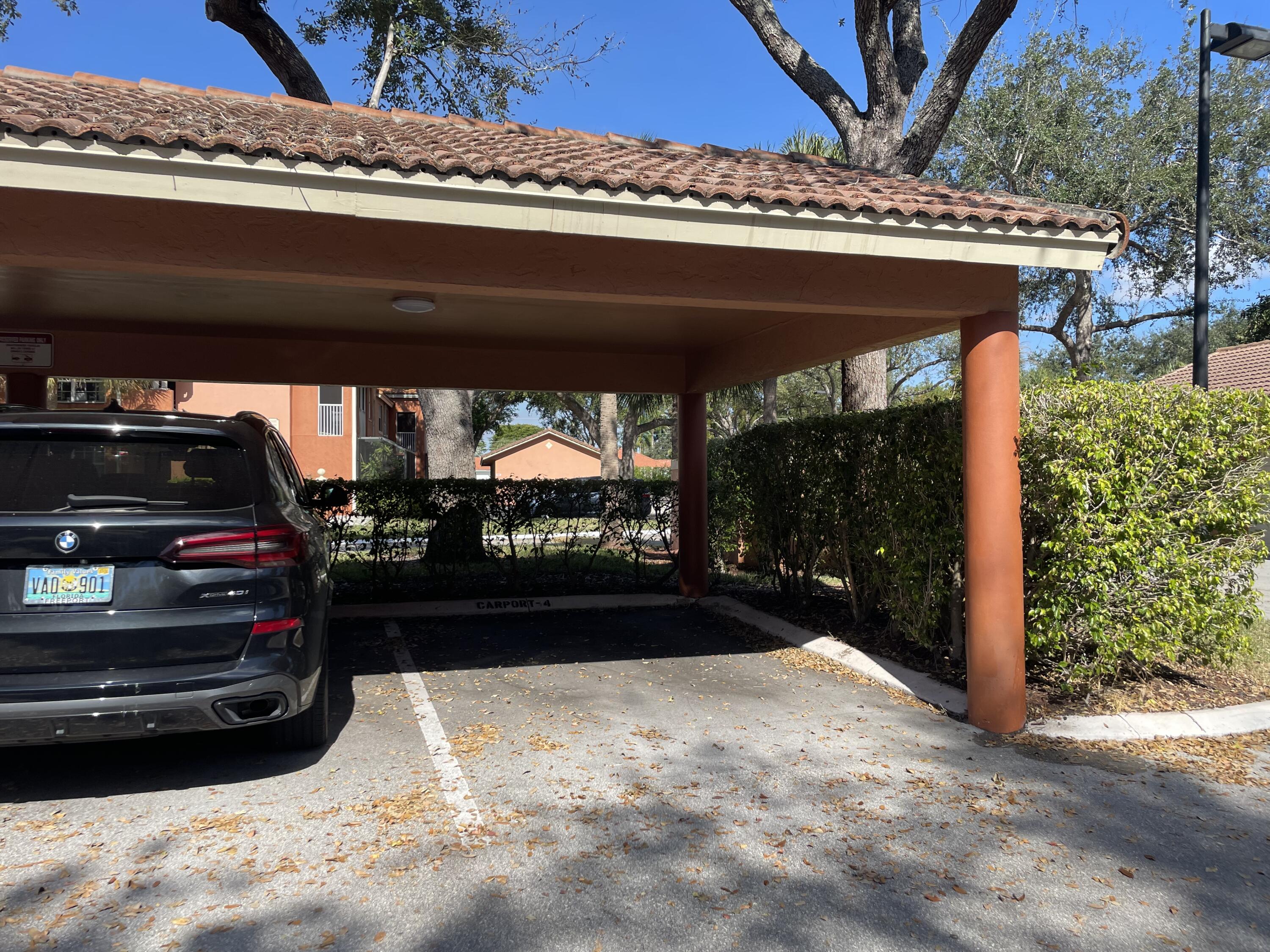 3143 Clint Moore Road, Unit 105 Boca Raton, FL 33496 - Photo 25 of 49 Carport