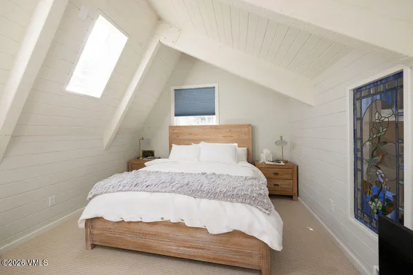 a view of a house with a yard and garden