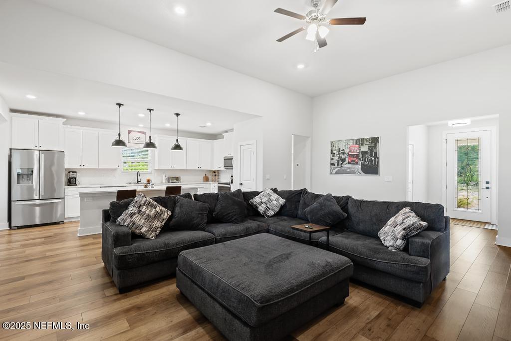 36012 Pitch Lane Hilliard, FL 32046 - Photo 12 of 54 a living room with furniture and kitchen view