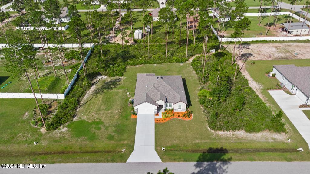 36012 Pitch Lane Hilliard, FL 32046 - Photo 2 of 54 an aerial view of a residential houses with outdoor space