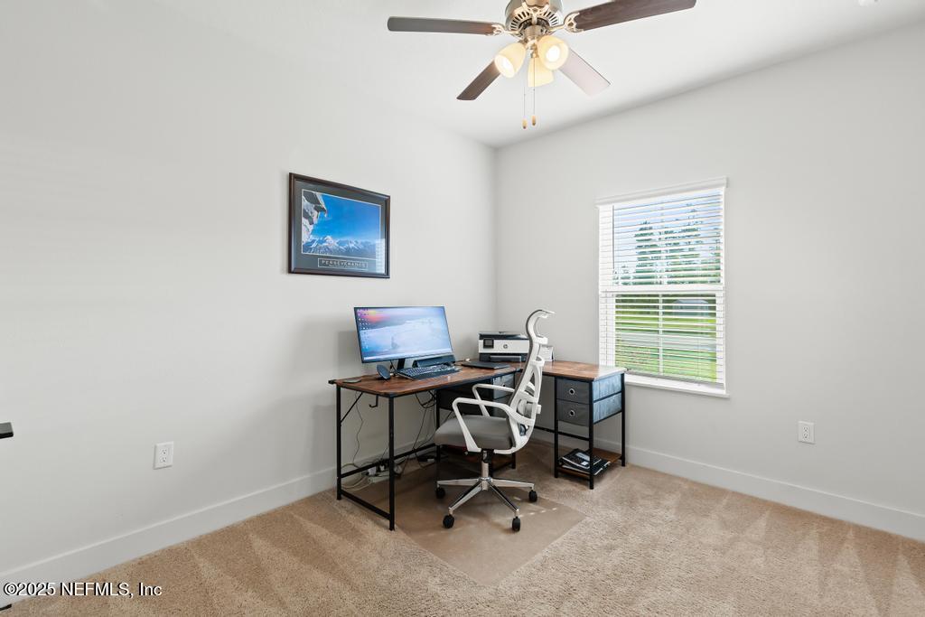 36012 Pitch Lane Hilliard, FL 32046 - Photo 24 of 54 a view of a workspace with furniture and a window