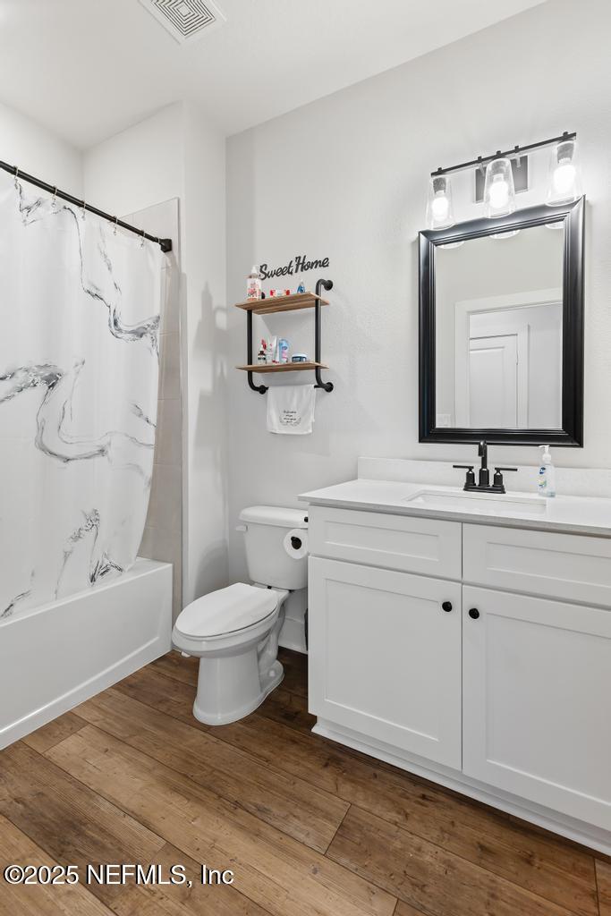 36012 Pitch Lane Hilliard, FL 32046 - Photo 26 of 54 a bathroom with a sink a toilet and shower