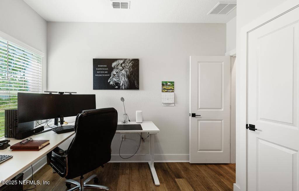 36012 Pitch Lane Hilliard, FL 32046 - Photo 31 of 54 a workspace with furniture and lamp